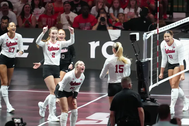 Aug 27, 2026; Arlington, TX, USA; Nebraska Cornhuskers players celebrate a point during their volleyball match against the SMU Mustangs at AT & T Stadium. Mandatory Credit: Chris Jones-Imagn Images
