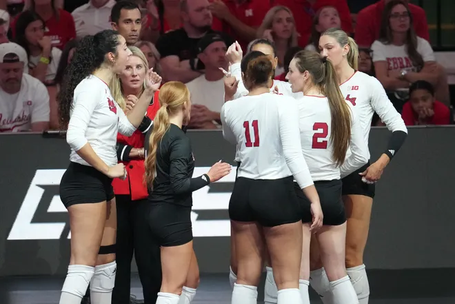 Aug 27, 2026; Arlington, TX, USA; Nebraska Cornhuskers players gather during a timeout in their volleyball match against the SMU Mustangs at AT & T Stadium. Mandatory Credit: Chris Jones-Imagn Images