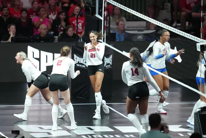 Aug 27, 2026; Arlington, TX, USA; Nebraska Cornhuskers players celebrate a point during their volleyball match against the SMU Mustangs at AT & T Stadium. Mandatory Credit: Chris Jones-Imagn Images
