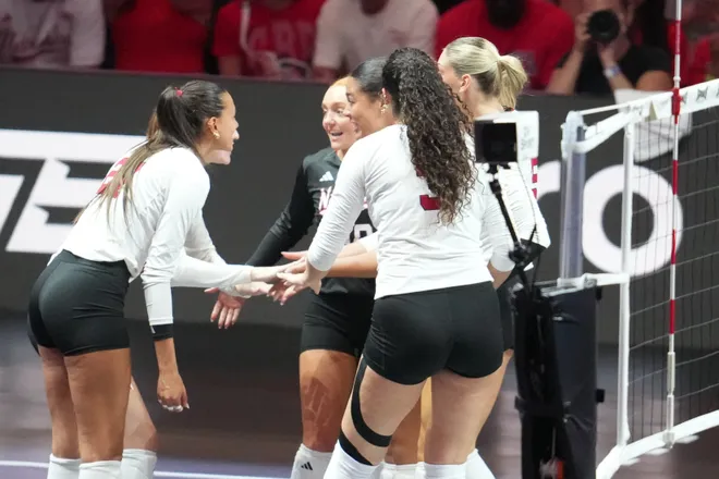 Aug 28, 2026; Arlington, TX, USA; Nebraska Cornhuskers players celebrate a point during their volleyball match against the SMU Mustangs at AT & T Stadium. Mandatory Credit: Chris Jones-Imagn Images