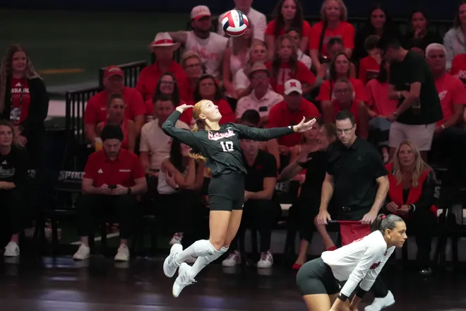 Aug 28, 2026; Arlington, TX, USA; Nebraska Cornhuskers defensive specialist/libero Olivia Mauch (10) serves the ball during their volleyball match against the SMU Mustangs at AT & T Stadium. Mandatory Credit: Chris Jones-Imagn Images