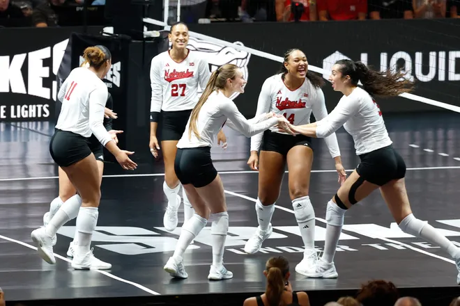 Aug 27, 2026; Arlington, TX, USA; Nebraska Cornhuskers players celebrate a point during their volleyball match against the Florida Gators at AT & T Stadium. Mandatory Credit: Chris Jones-Imagn Images