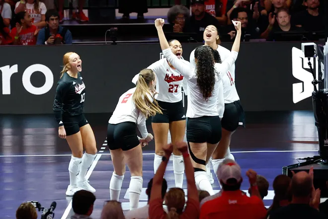 Aug 27, 2026; Arlington, TX, USA; Nebraska Cornhuskers players celebrate a point during their volleyball match against the Florida Gators at AT & T Stadium. Mandatory Credit: Chris Jones-Imagn Images