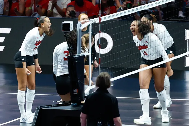 Aug 27, 2026; Arlington, TX, USA; Nebraska Cornhuskers players celebrate a point during their volleyball match against the Florida Gators at AT & T Stadium. Mandatory Credit: Chris Jones-Imagn Images