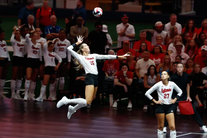 Aug 27, 2026; Arlington, TX, USA; Nebraska Cornhuskers middle blocker Andi Jackson (15) serves the ball during their volleyball match against the Florida Gators at AT & T Stadium. Mandatory Credit: Chris Jones-Imagn Images