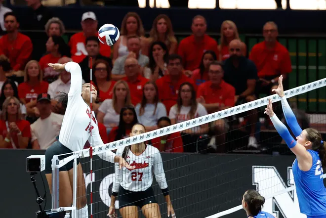 Aug 27, 2026; Arlington, TX, USA; Nebraska Cornhuskers middle blocker Manaia Ogbechie (14) attacks the ball against the Florida Gators during their volleyball match at AT & T Stadium. Mandatory Credit: Chris Jones-Imagn Images