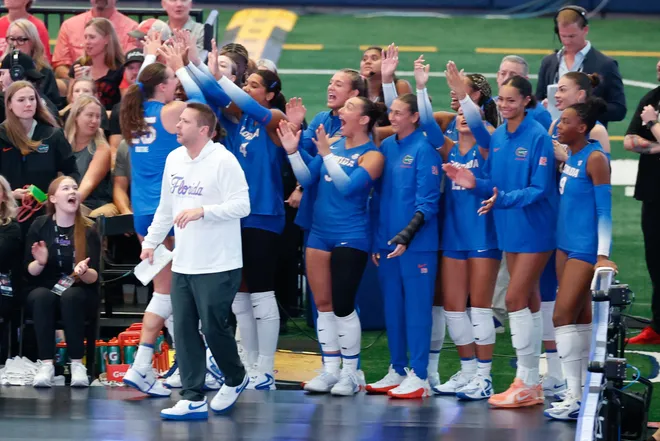 Aug 27, 2026; Arlington, TX, USA; Florida Gators players celebrate from the sideline during their volleyball match against the Nebraska Cornhuskers at AT & T Stadium. Mandatory Credit: Chris Jones-Imagn Images