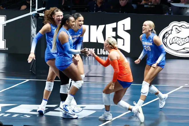 Aug 27, 2026; Arlington, TX, USA; Florida Gators players celebrate a point during their volleyball match against the Nebraska Cornhuskers at AT & T Stadium. Mandatory Credit: Chris Jones-Imagn Images