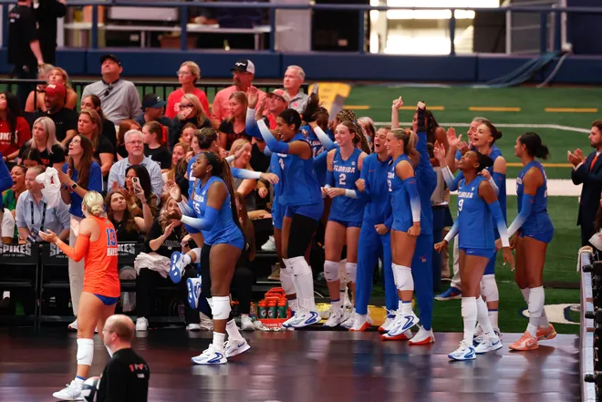 Aug 27, 2026; Arlington, TX, USA; Florida Gators players celebrate from the sideline during their volleyball match against the Nebraska Cornhuskers at AT & T Stadium. Mandatory Credit: Chris Jones-Imagn Images