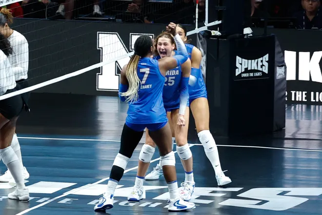 Aug 27, 2026; Arlington, TX, USA; Florida Gators players celebrate a point during their volleyball match against the Nebraska Cornhuskers at AT & T Stadium. Mandatory Credit: Chris Jones-Imagn Images