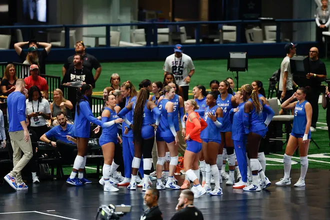 Aug 27, 2026; Arlington, TX, USA; Florida Gators players gather on the sideline before their volleyball match against the Nebraska Cornhuskers at AT & T Stadium. Mandatory Credit: Chris Jones-Imagn Images