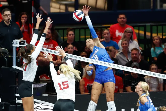 Aug 27, 2026; Arlington, TX, USA; Florida Gators opposite Logan King (8) attacks the ball against the Nebraska Cornhuskers during their volleyball match at AT & T Stadium. Mandatory Credit: Chris Jones-Imagn Images