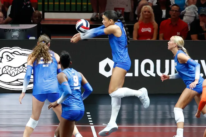 Aug 27, 2026; Arlington, TX, USA; Florida Gators opposite Logan King (8) attacks the ball during their volleyball match against the Nebraska Cornhuskers at AT & T Stadium. Mandatory Credit: Chris Jones-Imagn Images