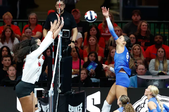 Aug 27, 2026; Arlington, TX, USA; Florida Gators opposite Logan King (8) attacks the ball against the Nebraska Cornhuskers during their volleyball match at AT & T Stadium. Mandatory Credit: Chris Jones-Imagn Images