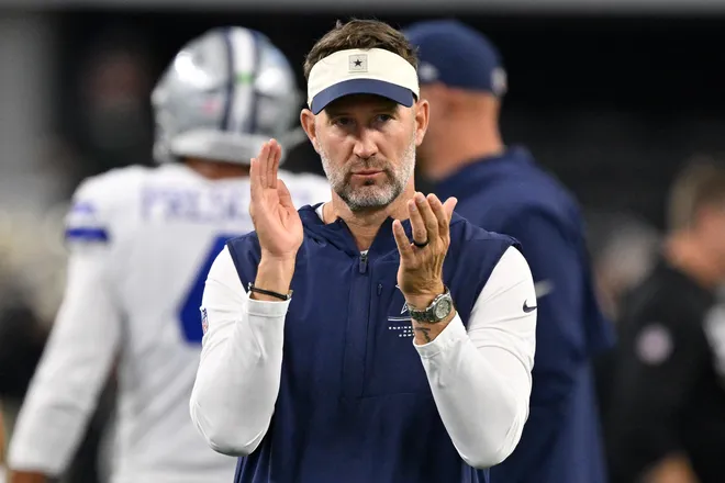 Aug 28, 2026; Arlington, Texas, USA; Dallas Cowboys head coach Brian Schottenheimer looks on during warm ups before the game against the New Orleans Saints at AT & T Stadium. Mandatory Credit: Jerome Miron-Imagn Images