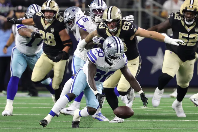 Aug 28, 2026; Arlington, Texas, USA; Dallas Cowboys running back Israel Abanikanda (30) recovers a fumble against the New Orleans Saints in the first quarter at AT & T Stadium. Mandatory Credit: Kevin Jairaj-Imagn Images