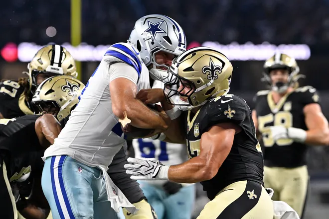 Aug 28, 2026; Arlington, Texas, USA; Dallas Cowboys quarterback Sam Howell (16) runs for a two-point conversion against New Orleans Saints linebacker Jackson Sirmon (47) during the fourth quarter at AT & T Stadium. Mandatory Credit: Jerome Miron-Imagn Images
