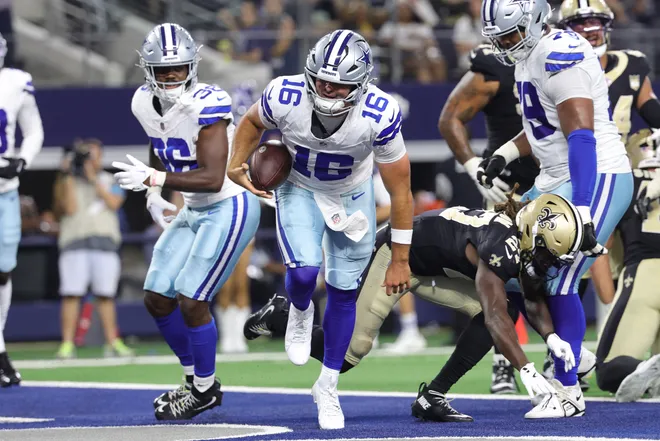Aug 28, 2026; Arlington, Texas, USA; Dallas Cowboys quarterback Sam Howell (16) scores a two-point conversion against the New Orleans Saints during the fourth quarter at AT & T Stadium. Mandatory Credit: Kevin Jairaj-Imagn Images