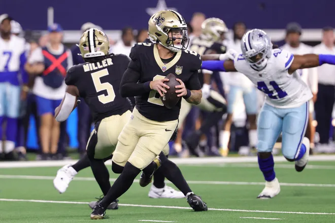 Aug 28, 2026; Arlington, Texas, USA; New Orleans Saints quarterback Spencer Rattler (2) looks to pass against the Dallas Cowboys in the first quarter at AT & T Stadium. Mandatory Credit: Kevin Jairaj-Imagn Images