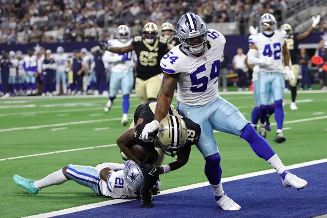 Aug 28, 2026; Arlington, Texas, USA; New Orleans Saints wide receiver Barion Brown (19) scores a touchdown against Dallas Cowboys cornerback Caelen Carson (21) and linebacker Sam Williams (54) during the first quarter at AT & T Stadium. Mandatory Credit: Kevin Jairaj-Imagn Images