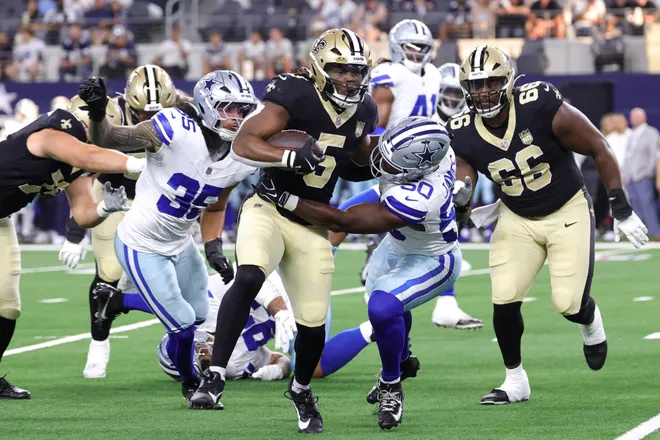 Aug 28, 2026; Arlington, Texas, USA; Dallas Cowboys linebacker Shemar James (50) tackles New Orleans Saints running back Kendre Miller (5) in the first quarter at AT & T Stadium. Mandatory Credit: Kevin Jairaj-Imagn Images