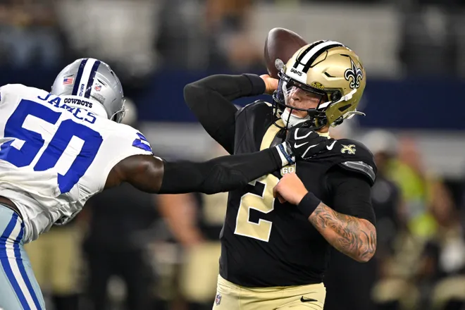Aug 28, 2026; Arlington, Texas, USA; New Orleans Saints quarterback Spencer Rattler (2) throws against Dallas Cowboys linebacker Shemar James (50) in the first quarter at AT & T Stadium. Mandatory Credit: Jerome Miron-Imagn Images