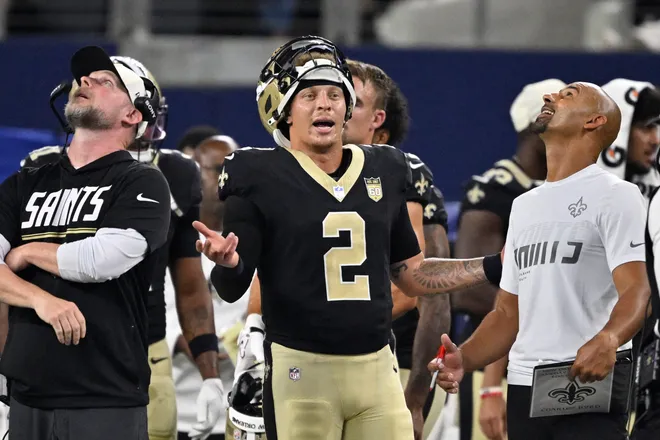 Aug 28, 2026; Arlington, Texas, USA; New Orleans Saints quarterback Spencer Rattler (2) reacts after his touchdown is reviewed during the second quarter against the Dallas Cowboys at AT & T Stadium. Mandatory Credit: Jerome Miron-Imagn Images