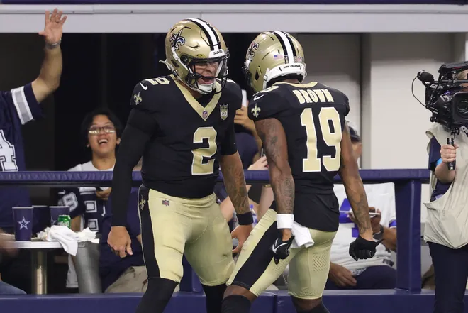 Aug 28, 2026; Arlington, Texas, USA; New Orleans Saints quarterback Spencer Rattler (2) celebrates with wide receiver Barion Brown (19) after scoring a touchdown against the Dallas Cowboys during the second quarter at AT & T Stadium. Mandatory Credit: Kevin Jairaj-Imagn Images