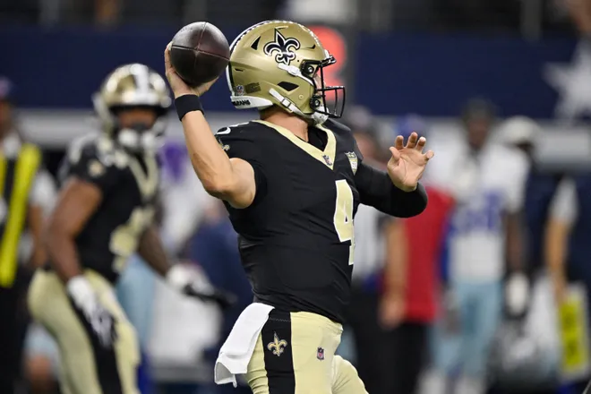 Aug 28, 2026; Arlington, Texas, USA; New Orleans Saints quarterback Zach Wilson (4) throws a pass against the Dallas Cowboys during the third quarter at AT & T Stadium. Mandatory Credit: Jerome Miron-Imagn Images
