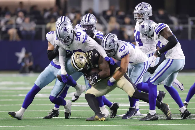 Aug 28, 2026; Arlington, Texas, USA; Dallas Cowboys linebacker Tyrus Wheat (90) and linebacker Langston Patterson (47) tackle New Orleans Saints running back Zamir White (33) during the third quarter at AT & T Stadium. Mandatory Credit: Kevin Jairaj-Imagn Images