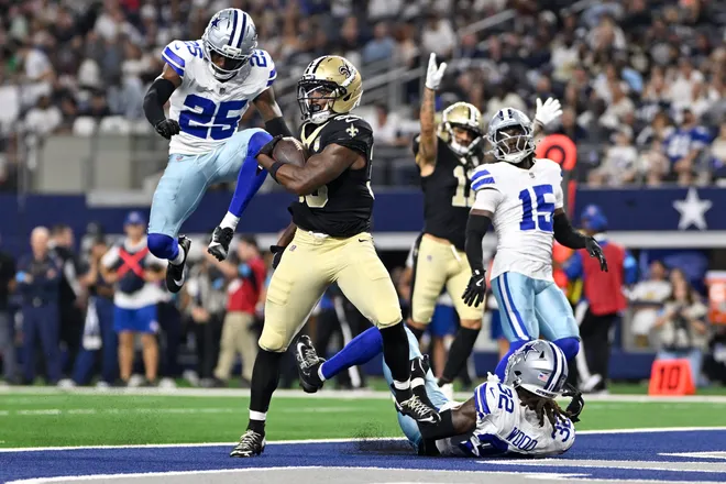 Aug 28, 2026; Arlington, Texas, USA; New Orleans Saints running back Zamir White (33) runs for a touchdown against the Dallas Cowboys during the third quarter at AT & T Stadium. Mandatory Credit: Jerome Miron-Imagn Images
