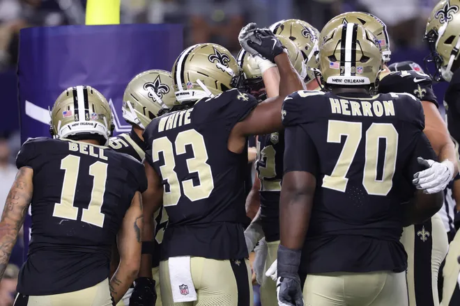Aug 28, 2026; Arlington, Texas, USA; New Orleans Saints running back Zamir White (33) celebrates with teammates after scoring a touchdown against the Dallas Cowboys during the third quarter at AT & T Stadium. Mandatory Credit: Kevin Jairaj-Imagn Images