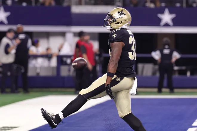 Aug 28, 2026; Arlington, Texas, USA; New Orleans Saints running back Zamir White (33) celebrates after scoring a touchdown against the Dallas Cowboys during the third quarter at AT & T Stadium. Mandatory Credit: Kevin Jairaj-Imagn Images