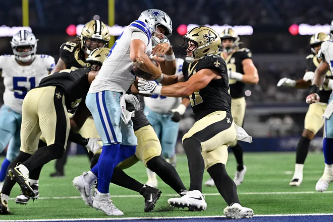Aug 28, 2026; Arlington, Texas, USA; Dallas Cowboys quarterback Sam Howell (16) runs for a two-point conversion against New Orleans Saints linebacker Jackson Sirmon (47) during the fourth quarter at AT & T Stadium. Mandatory Credit: Jerome Miron-Imagn Images