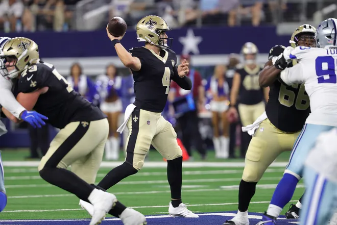 Aug 28, 2026; Arlington, Texas, USA; New Orleans Saints quarterback Zach Wilson (4) throws a pass against the Dallas Cowboys during the fourth quarter at AT & T Stadium. Mandatory Credit: Kevin Jairaj-Imagn Images