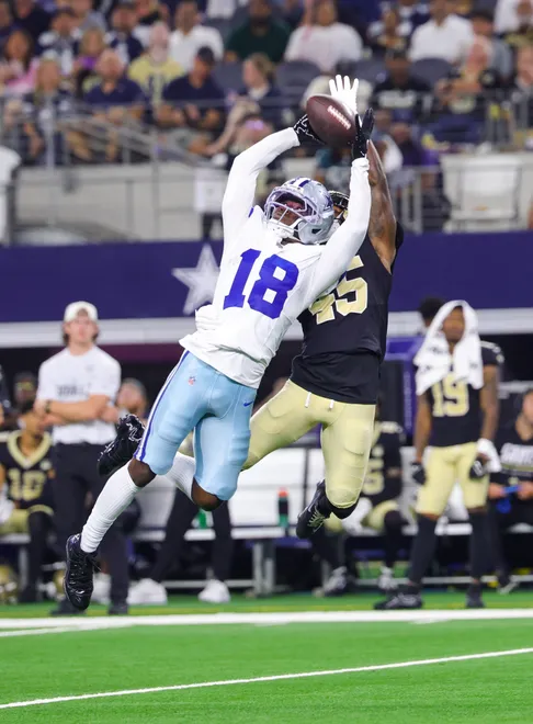 Aug 28, 2026; Arlington, Texas, USA; Dallas Cowboys wide receiver Jordan Hudson (18) makes a catch over New Orleans Saints cornerback David Long Jr. (45) during the second half at AT & T Stadium. Mandatory Credit: Kevin Jairaj-Imagn Images