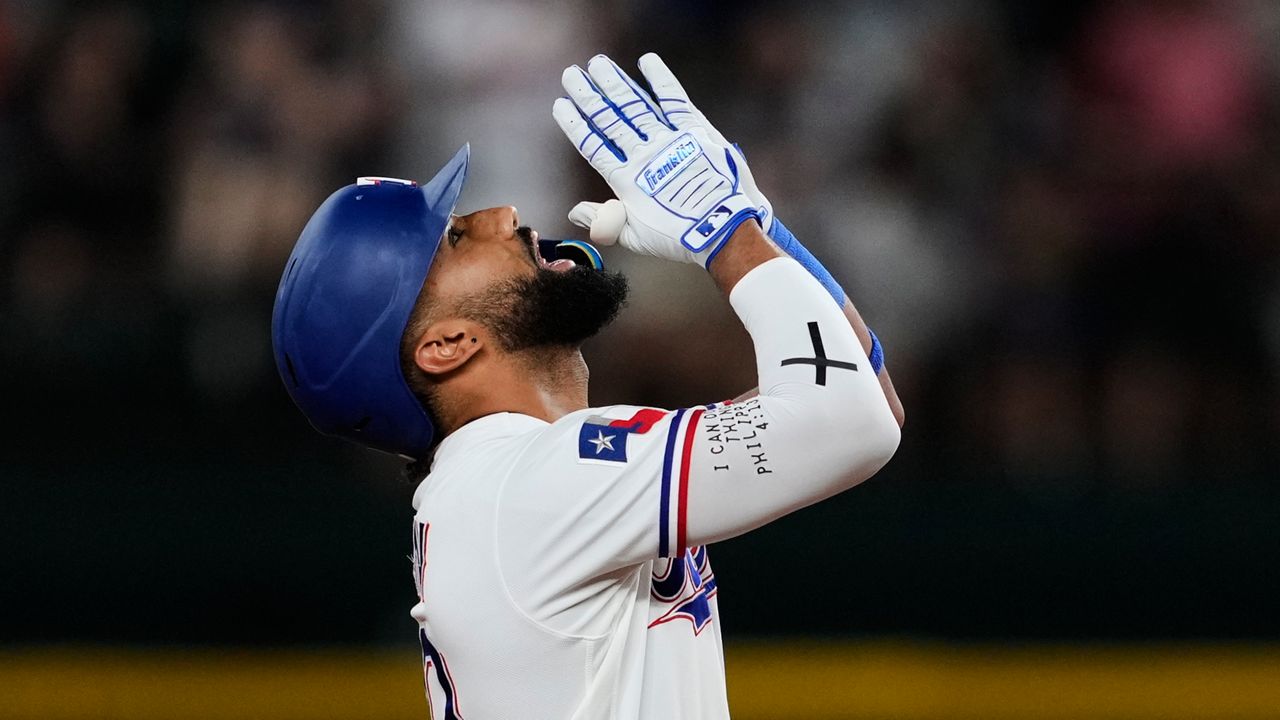 Texas Rangers' Ezequiel Duran celebrates his two-run double in the eighth inning a baseball game against the San Francisco Giants in Arlington, Texas, Tuesday, Aug. 4, 2026. (AP Photo/Tony Gutierrez)