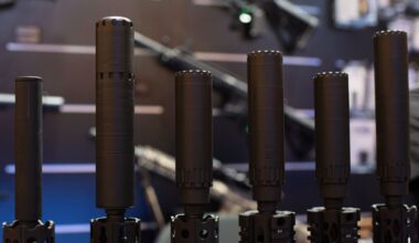 Firearms and suppressors are displayed at SHOT Show, the annual trade show for the gun industry, Jan. 21 2020, in Las Vegas. (AP Photo/Lisa Marie Pane, File)