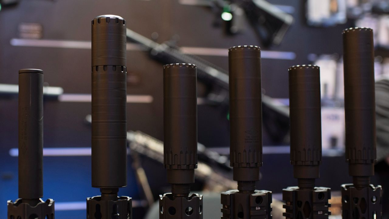 Firearms and suppressors are displayed at SHOT Show, the annual trade show for the gun industry, Jan. 21 2020, in Las Vegas. (AP Photo/Lisa Marie Pane, File)