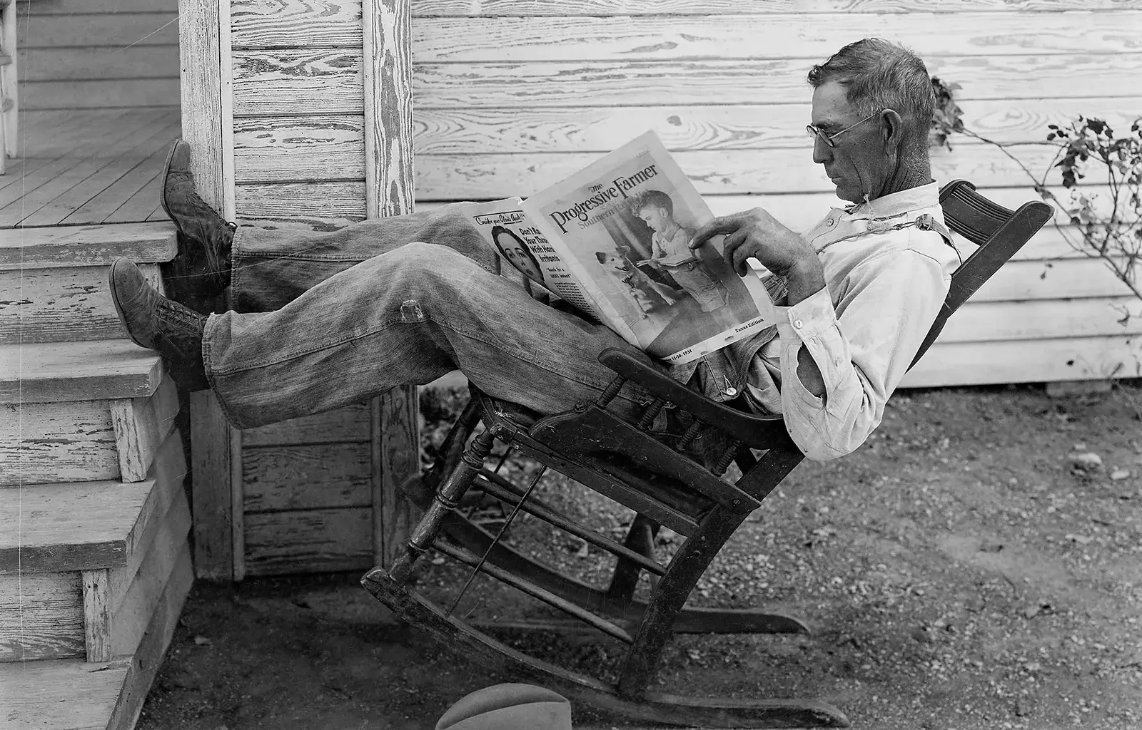 A Farmer Reading His Paper. Photographed by George W. Ackerman, Coryell County, Texas, September 1931.