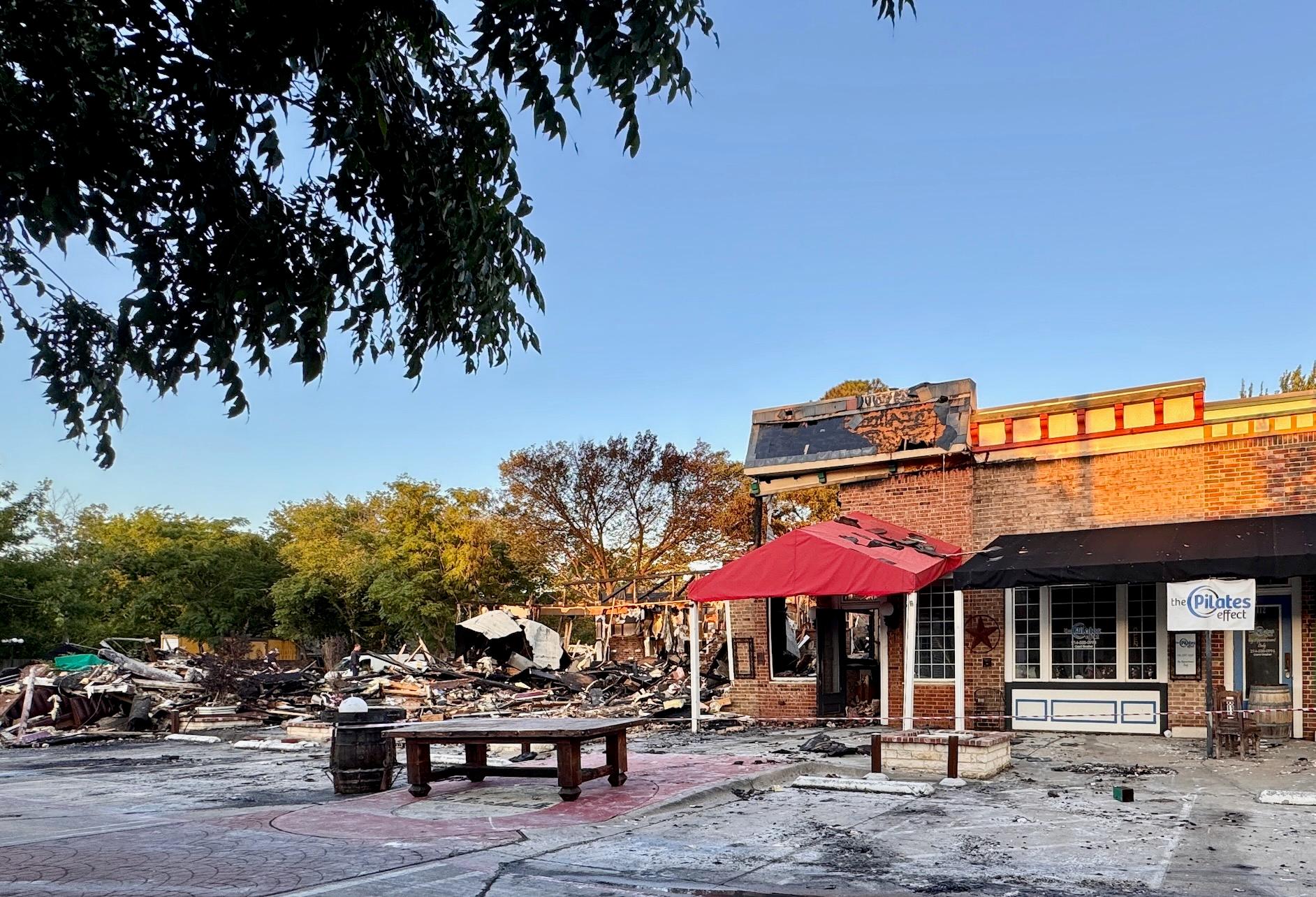 a fire devastated two restaurants in Arlington Monday afternoon.