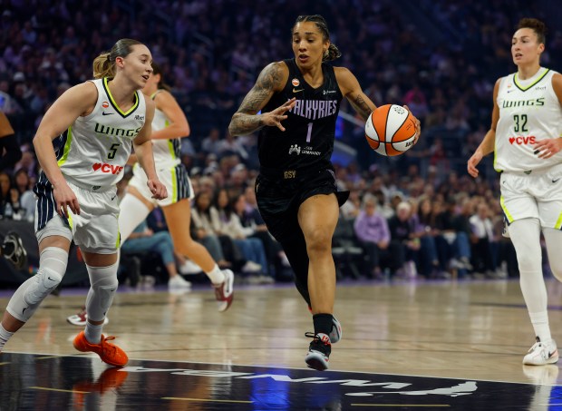 Golden State Valkyries' Gabby Williams (1) dribbles against Dallas Wings' Paige Bueckers (5) in the first quarter at the Chase Center in San Francisco, Calif., on Monday, Aug. 17, 2026. (Nhat V. Meyer/Bay Area News Group)
