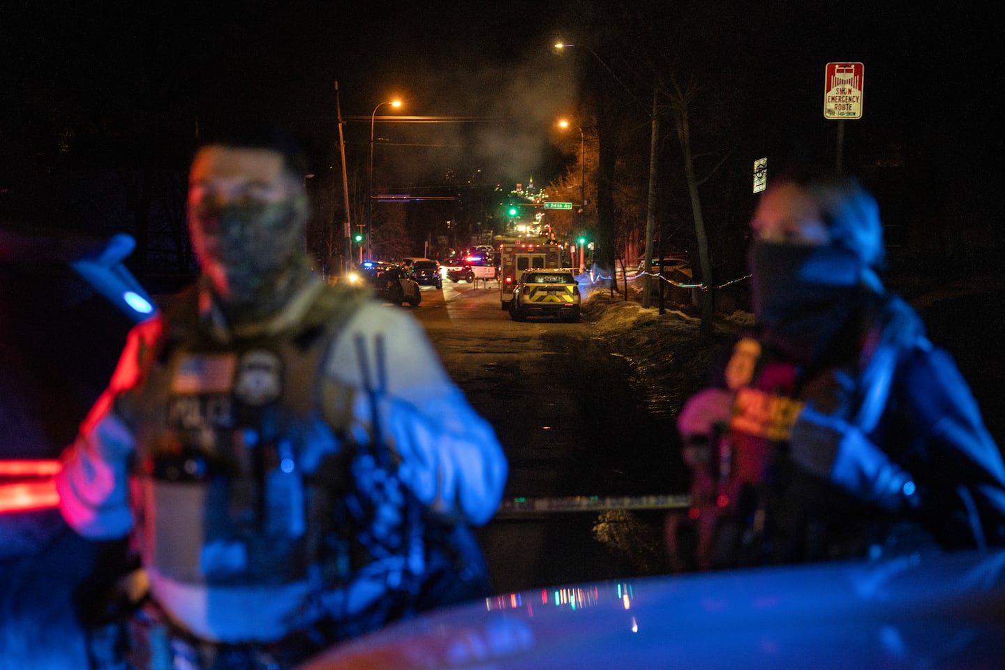 Federal agents stood near the scene where an ICE officer shot a man from Venezuela while trying to detain him in January, 2026.