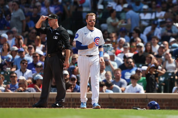 Cubs left fielder Ian Happ throws his batting gloves after striking out against White Sox on Wednesday, Aug. 19, 2026, at Wrigley Field. (Eileen T. Meslar/Chicago Tribune)