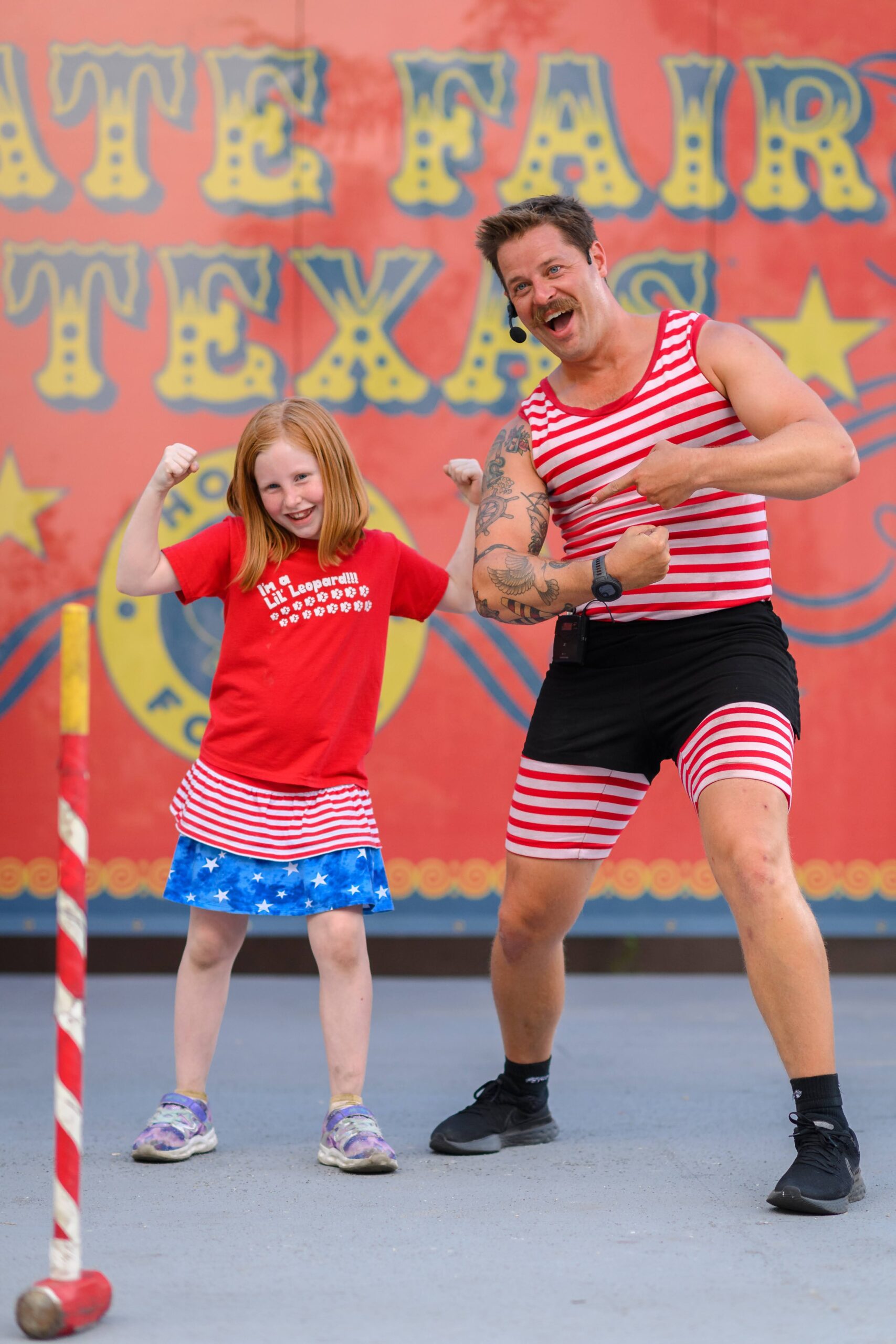 State Fair of Texas show Mighty Mike with audience participant. 
