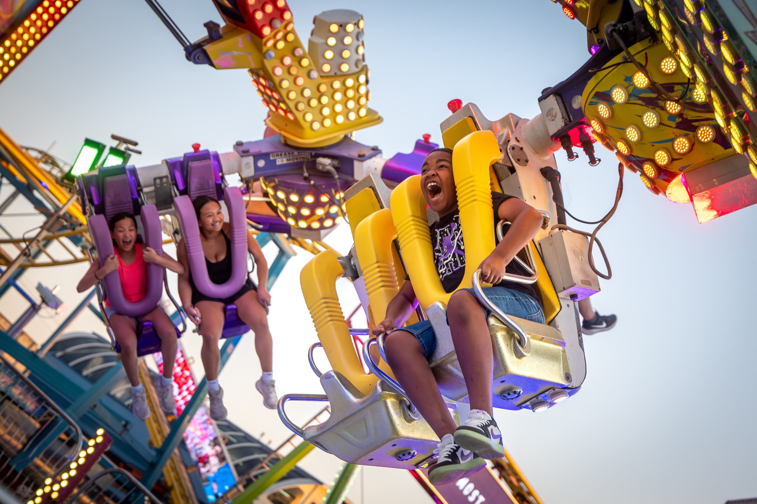 Young women on a State Fair of Texas Ride. 