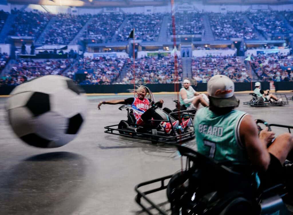 Dude Perfect guys playing go-kart soccer at a live event