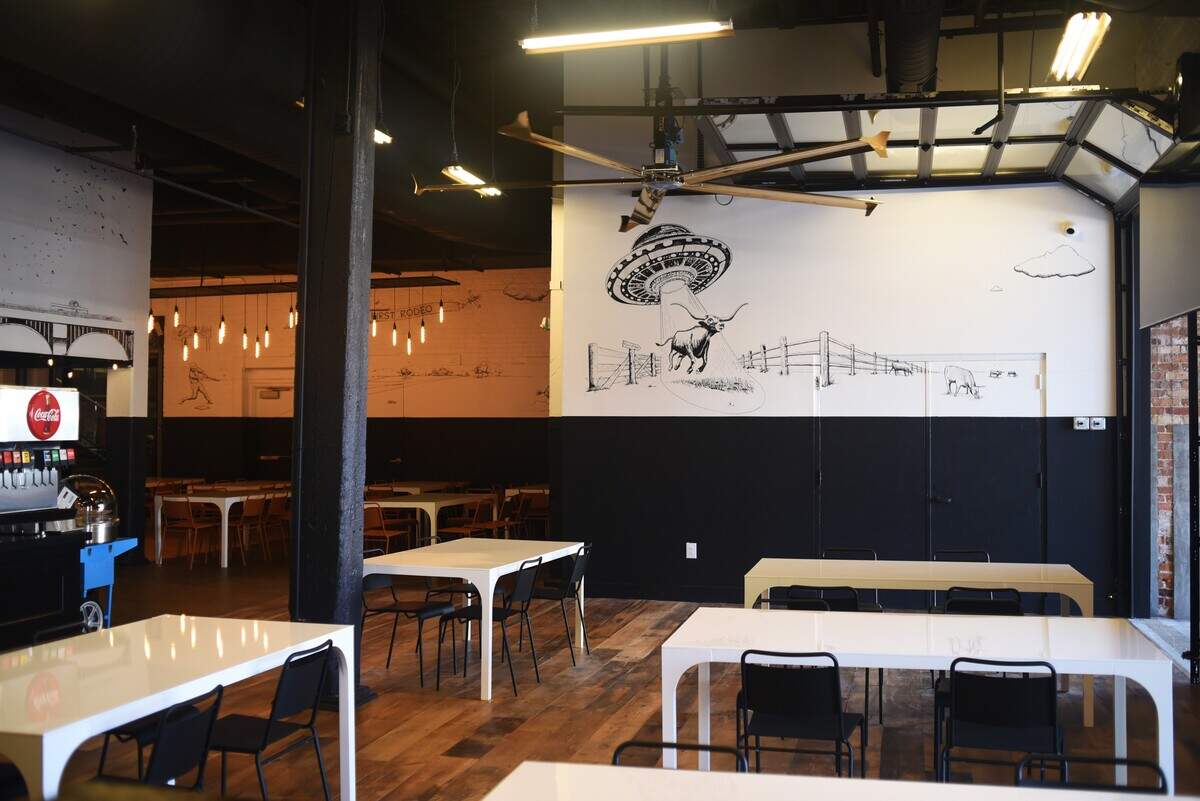 The new East of Texas barbecue restaurant in Durham features a pair of garage-style doors opening up the space to the American Tobacco Campus.