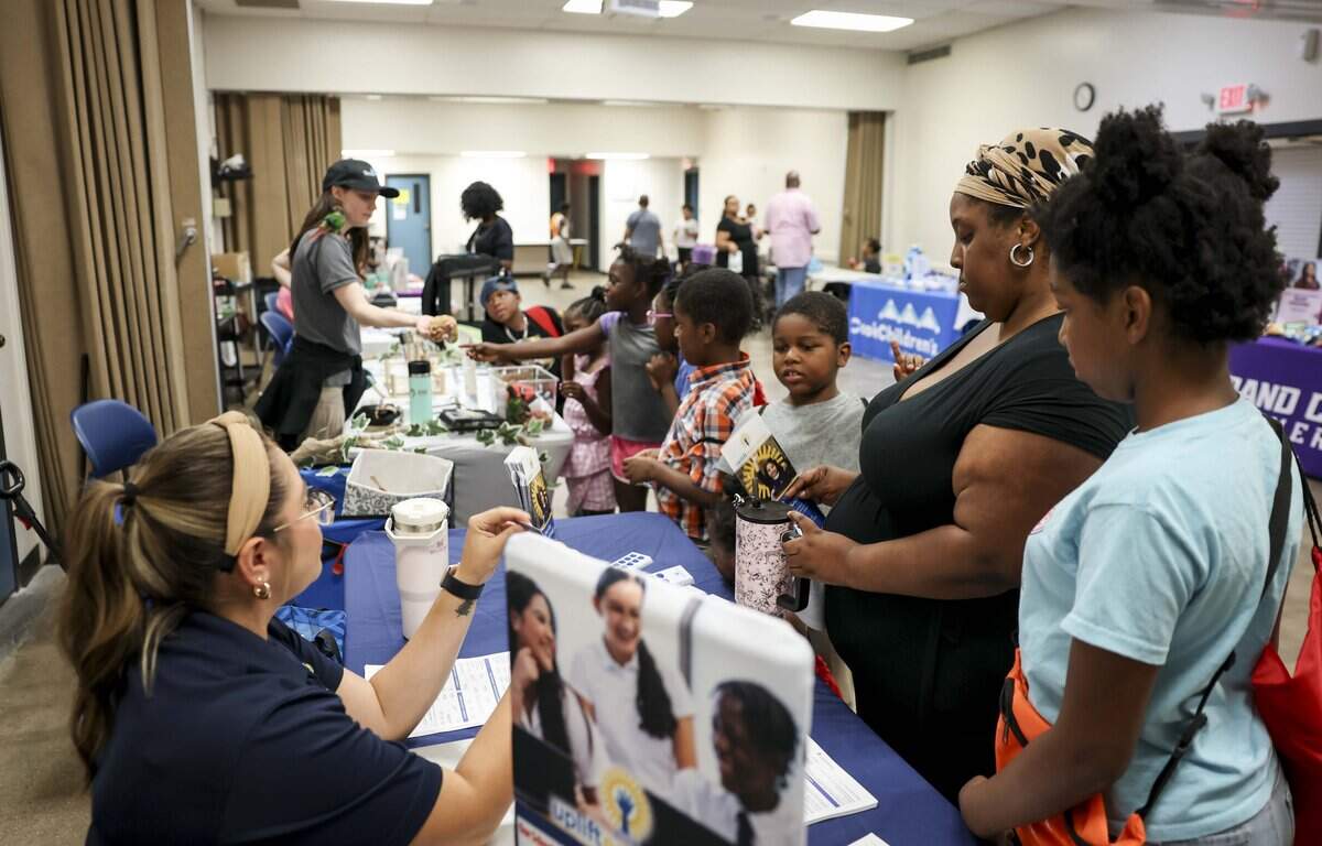 The Wallace family picks up school supplies during a giveaway as the 2026-2027 school year approaches on Friday, July 31, 2026 at the Southside Community Center in Fort Worth.