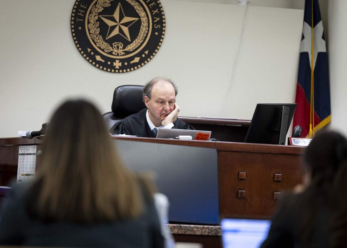 Judge Steven Jumes reviews video while the court is at ease during the trial of Tyler Hampton in the 485th District Court in Tarrant County on Tuesday, July 21, 2026 in Fort Worth. Hampton was indicted on intoxication manslaughter in the December 2021 death of 2-year-old Milania Pierite.